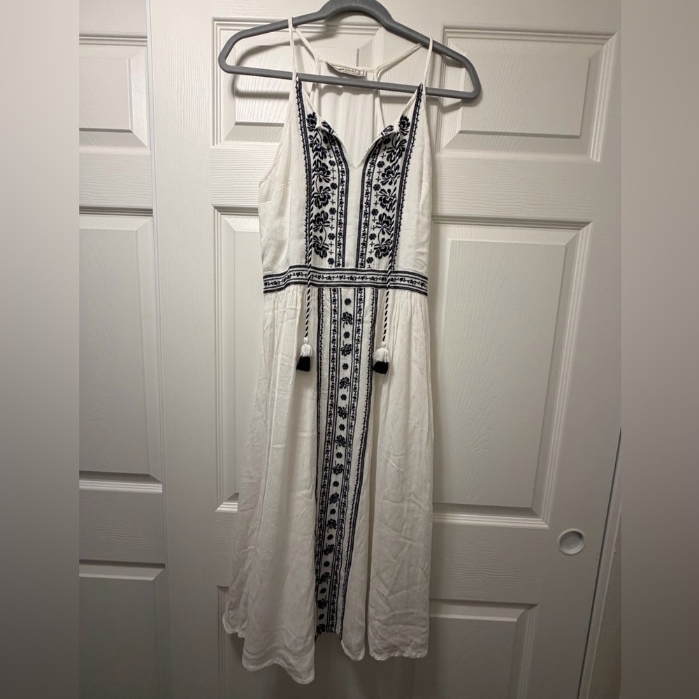 Abercrombie & Fitch White Dress with dark tassels. Good for any occasion.